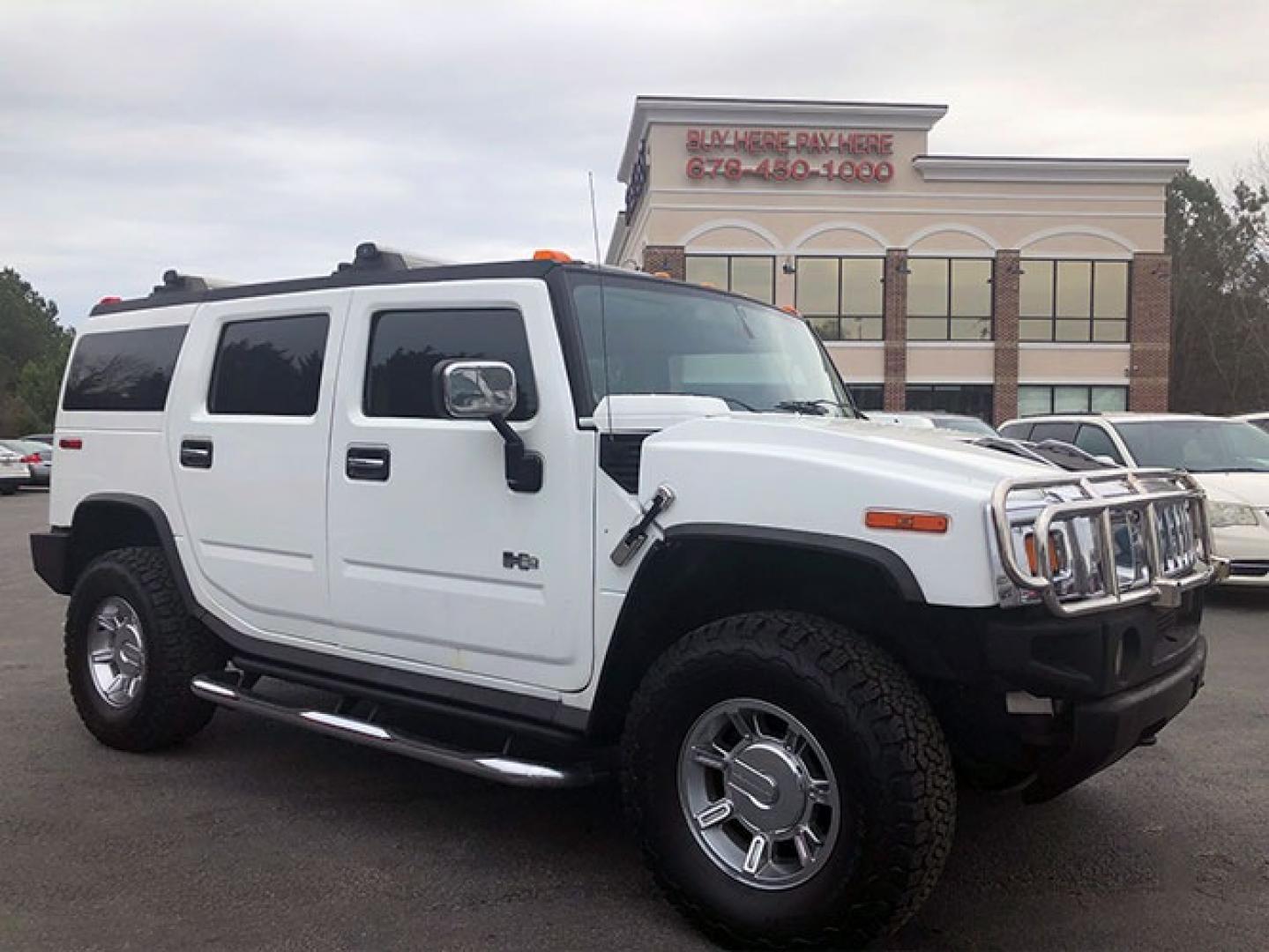 2004 Hummer H2 Sport Utility (5GRGN23U44H) with an 6.0L V8 OHV 16V engine, 4-Speed Automatic Overdrive transmission, located at 7710 Tara Blvd, Jonesboro, GA, 30236, (678) 450-1000, 33.544365, -84.367821 - Photo#0