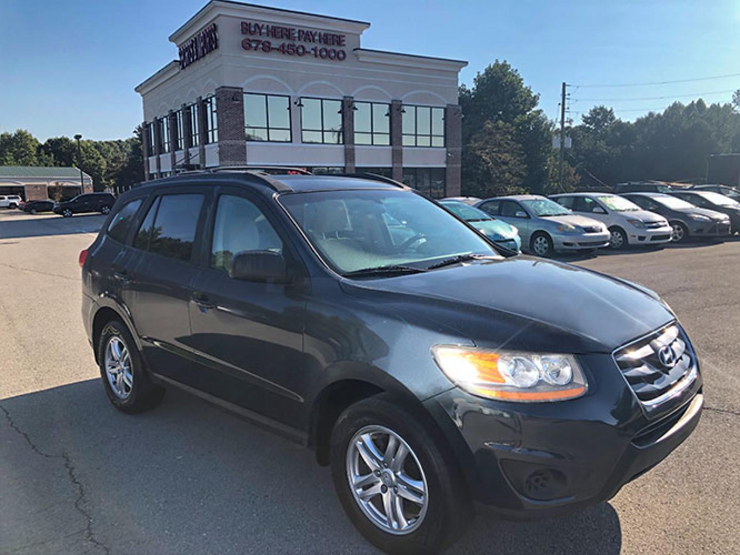 2011 Hyundai Santa Fe GL 2.4 FWD (5XYZG3AB6BG) with an 2.4L L4 DOHC 16V engine, 6-Speed Automatic transmission, located at 7710 Tara Blvd, Jonesboro, GA, 30236, (678) 450-1000, 33.544365, -84.367821 - Photo#0