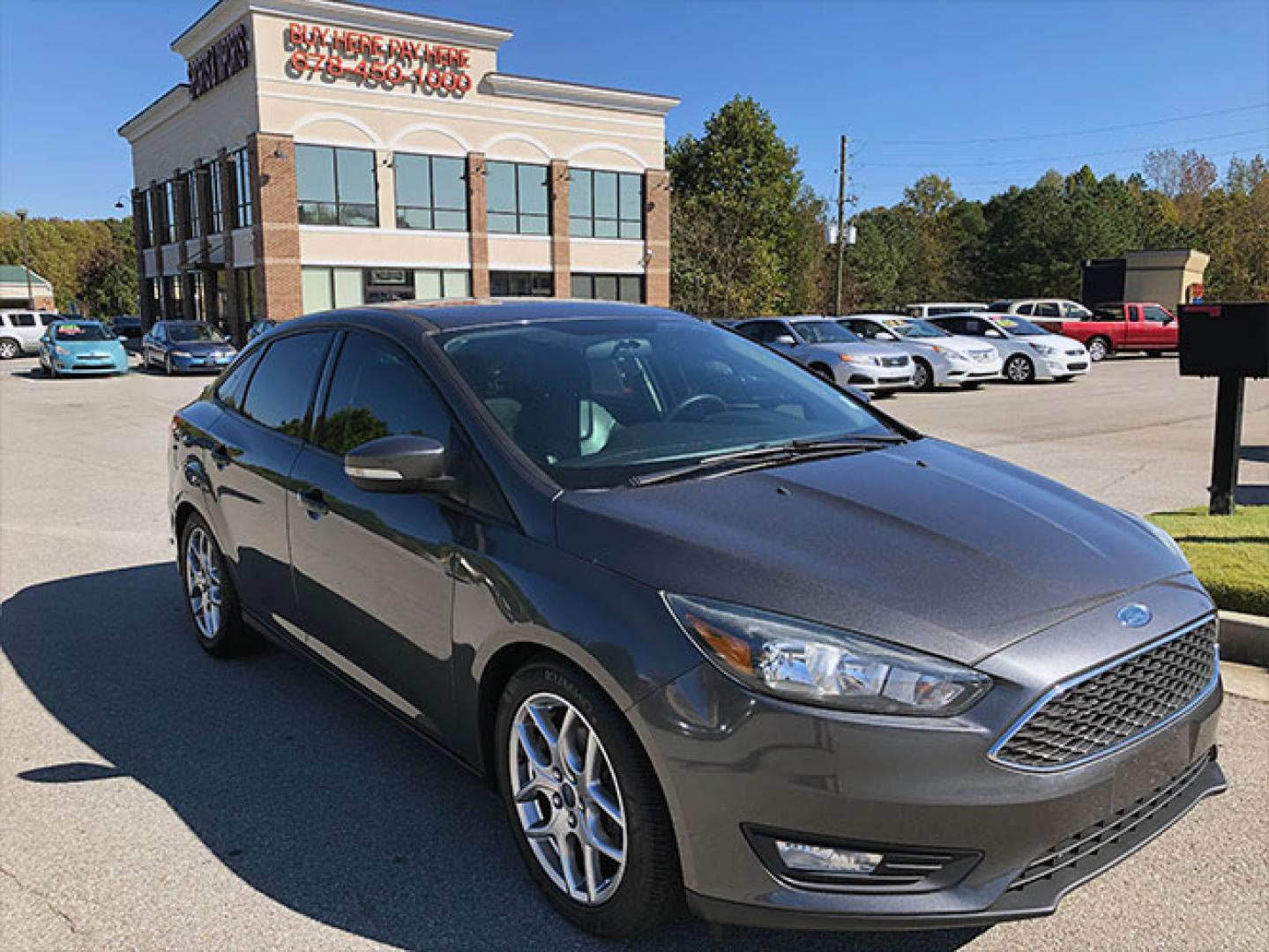 2015 Ford Focus SE Sedan (1FADP3F24FL) with an 2.0L L4 DOHC 16V engine, located at 620 Jesse Jewell Pkwy, Gainesville, GA, 30501, (678) 450-1000, 34.305923, -83.809784 - Photo#0