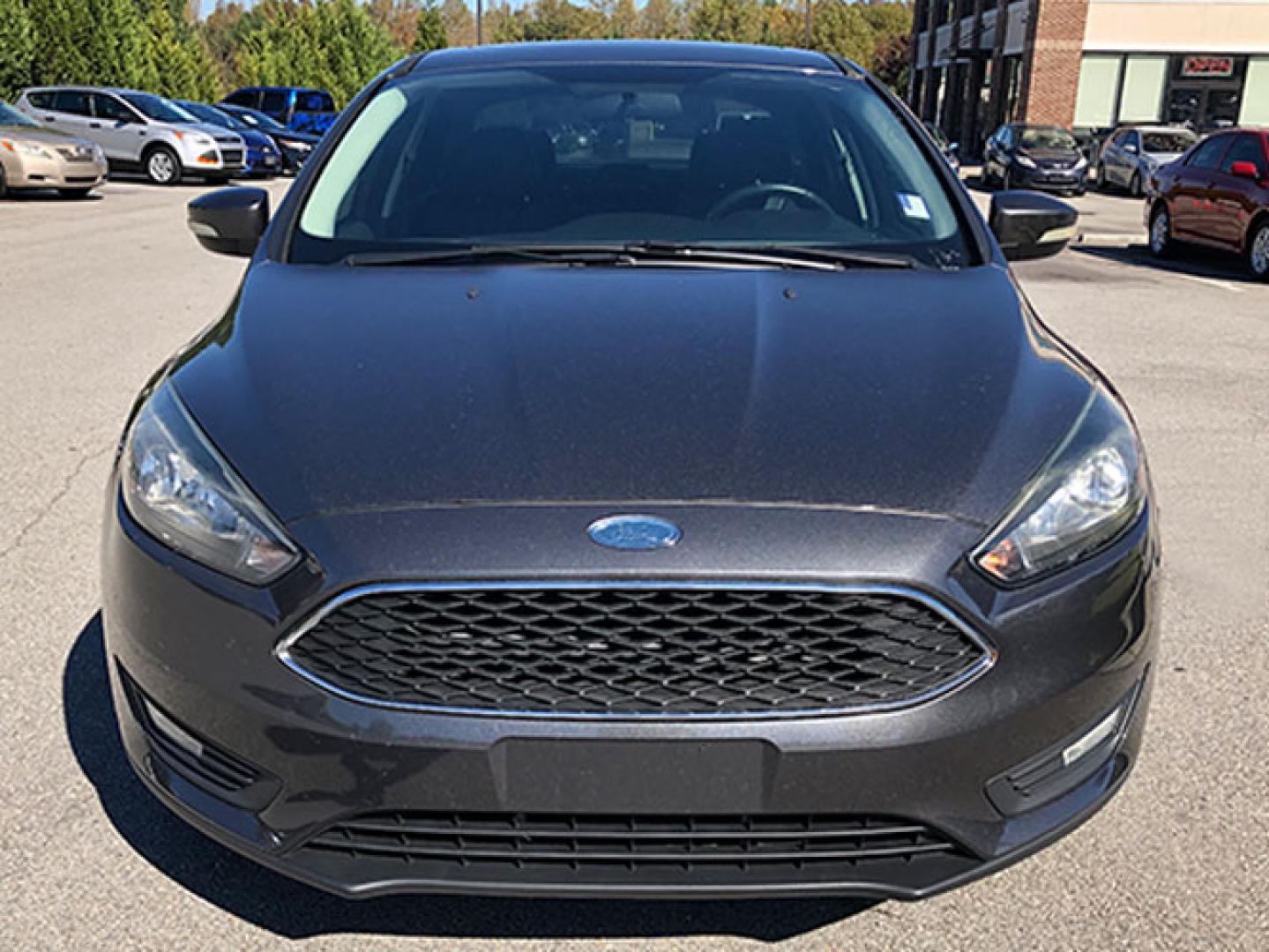 2015 Ford Focus SE Sedan (1FADP3F24FL) with an 2.0L L4 DOHC 16V engine, located at 620 Jesse Jewell Pkwy, Gainesville, GA, 30501, (678) 450-1000, 34.305923, -83.809784 - Photo#1